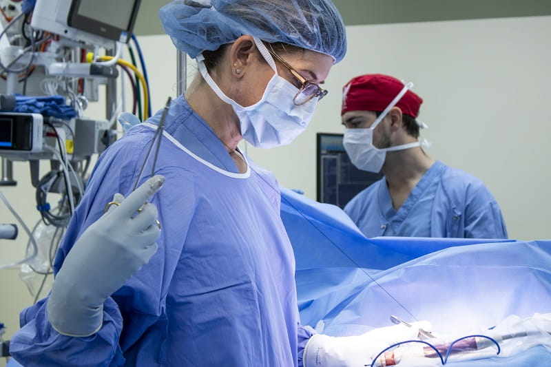 Photo of Carla Fisher MD, doing a operation