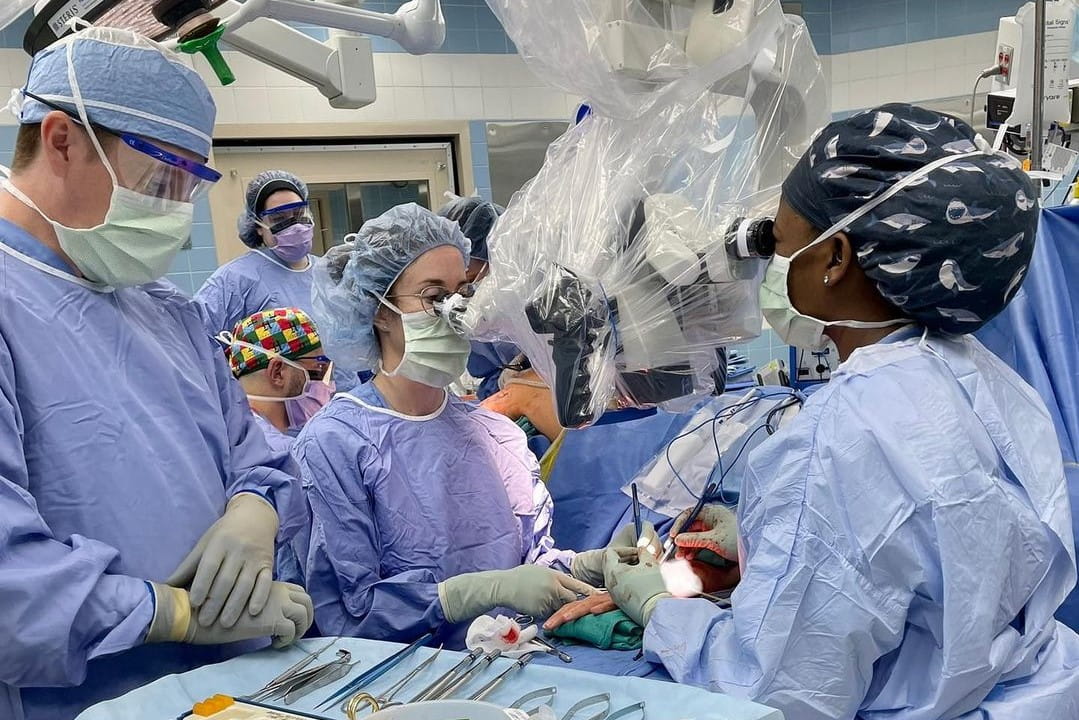 Cori Rogers, Jeff Gross and Rachel Danforth working in the OR