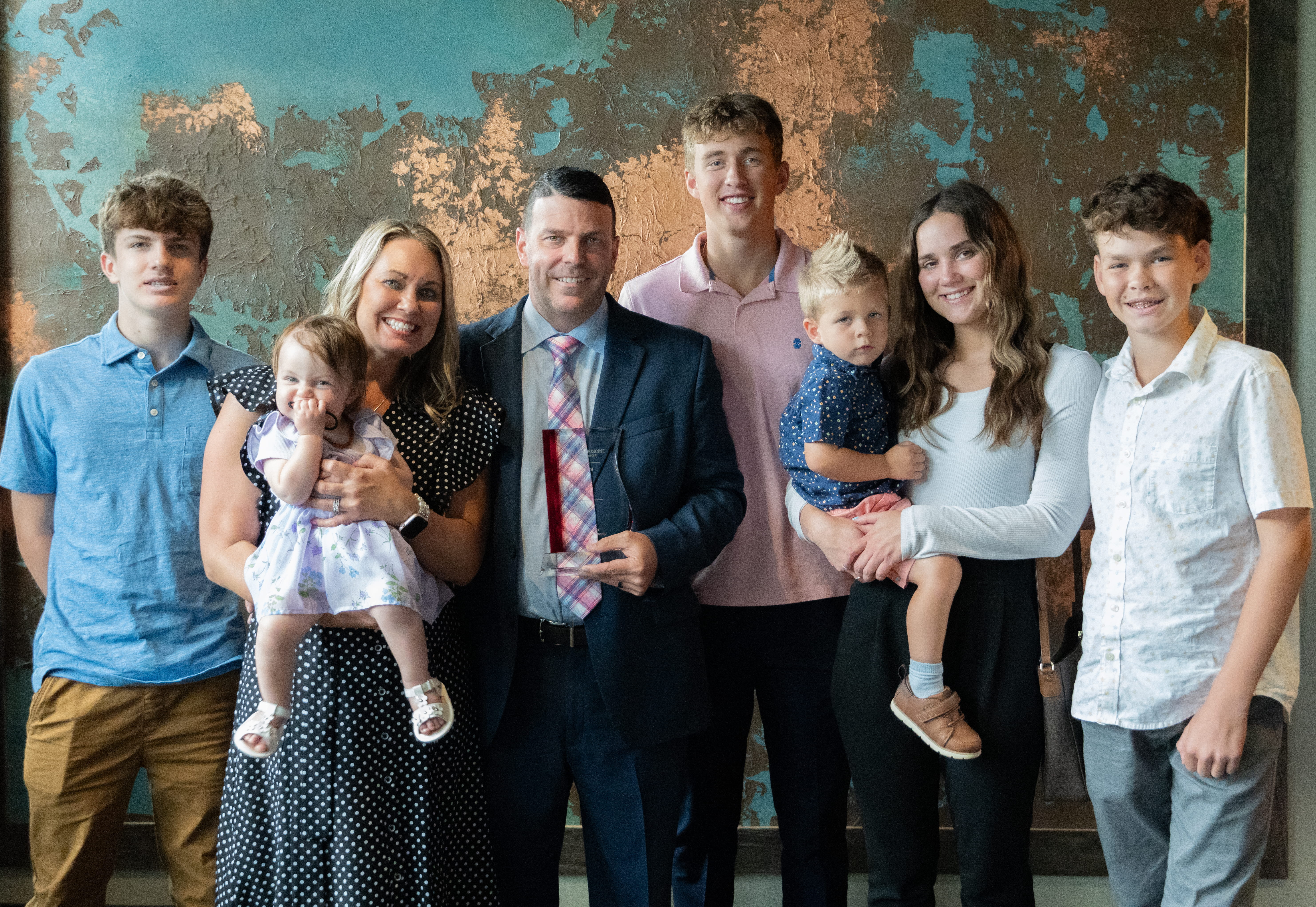 Dr. Troy A. Markel with his wife Sarah and children: Kayla (24), Austin (17), Thomas (17), Owen (15), Mason (13), Bentley (2), and Thea (1). 