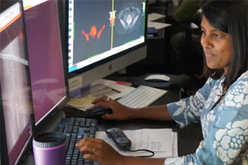 researcher looking at computer screens