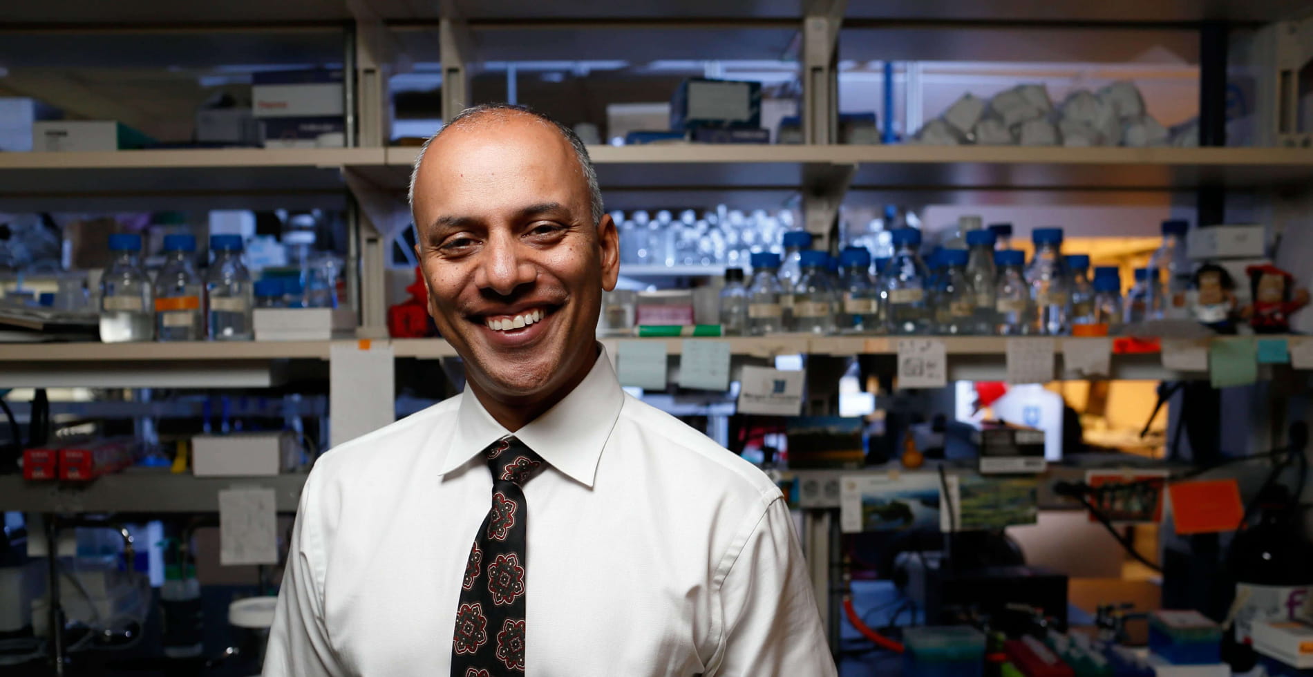 portrait of chandy john in his research lab