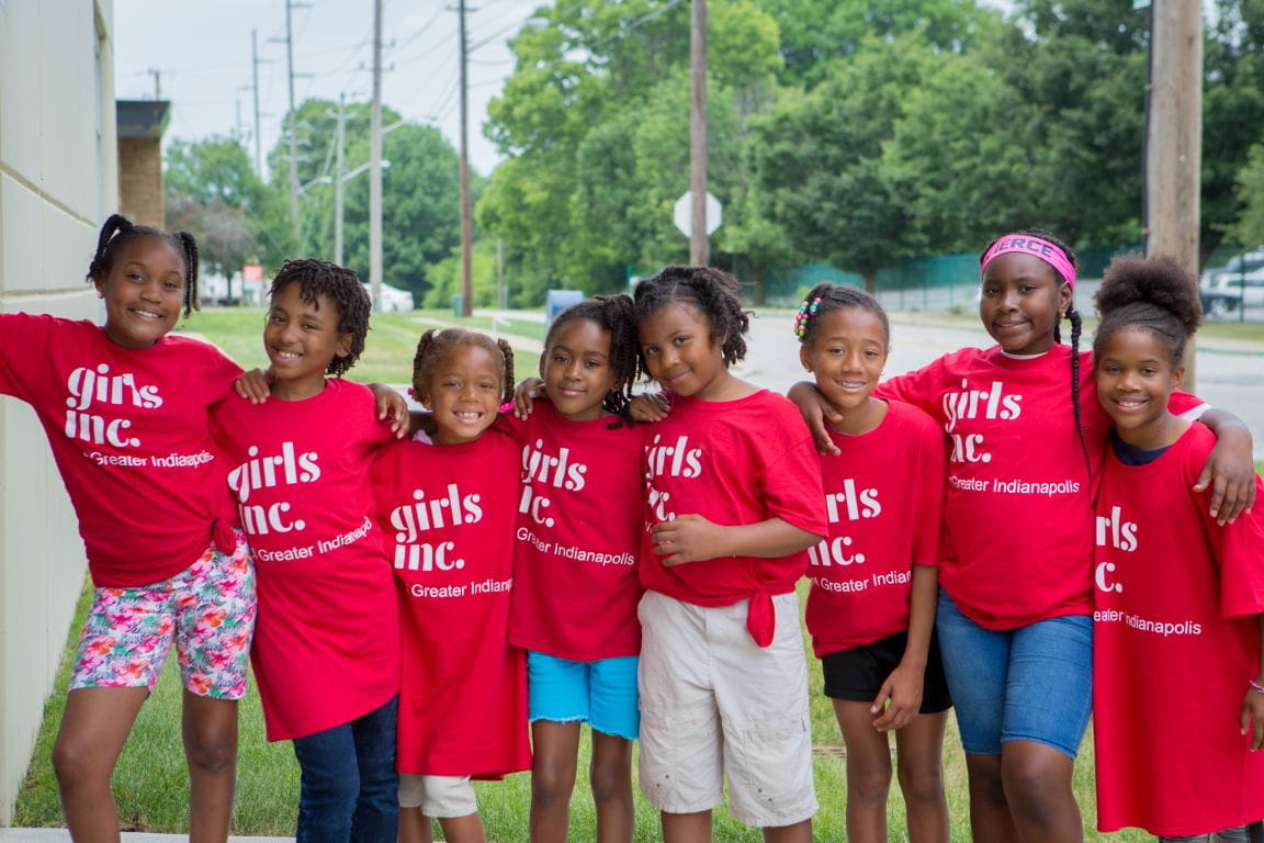 a group of girls in shirts that say "Girls Inc"