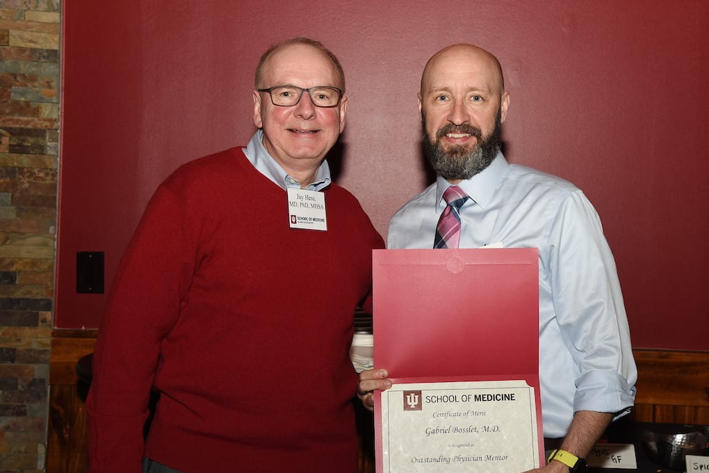 dean hess and gabe bosslet. Bosslet holds his new award