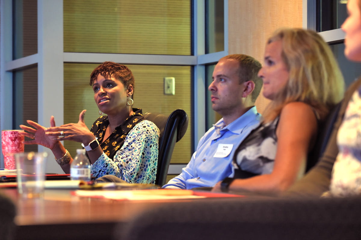 people at a group workshop talking together