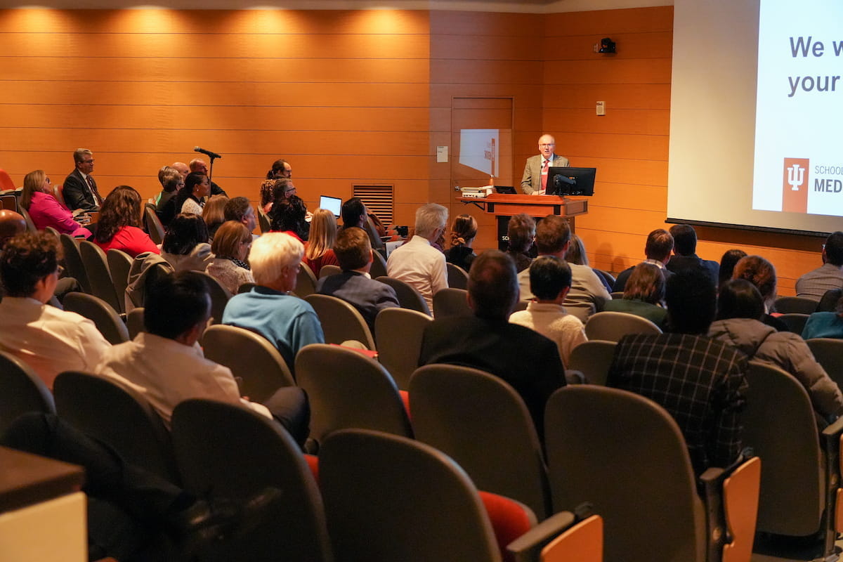 the dean and faculty at an all school meeting