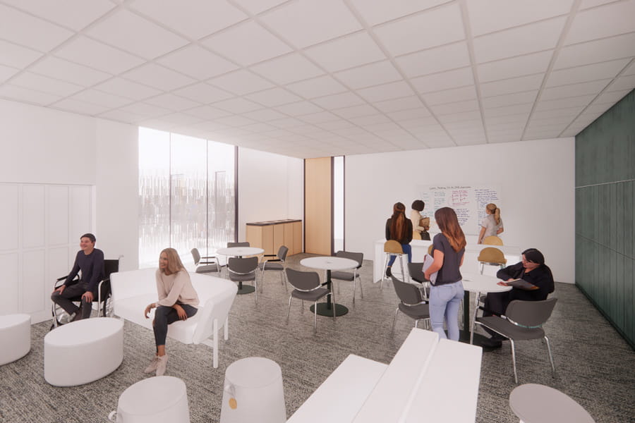 rendering of a common space shows multiple seating options and people working and talking together