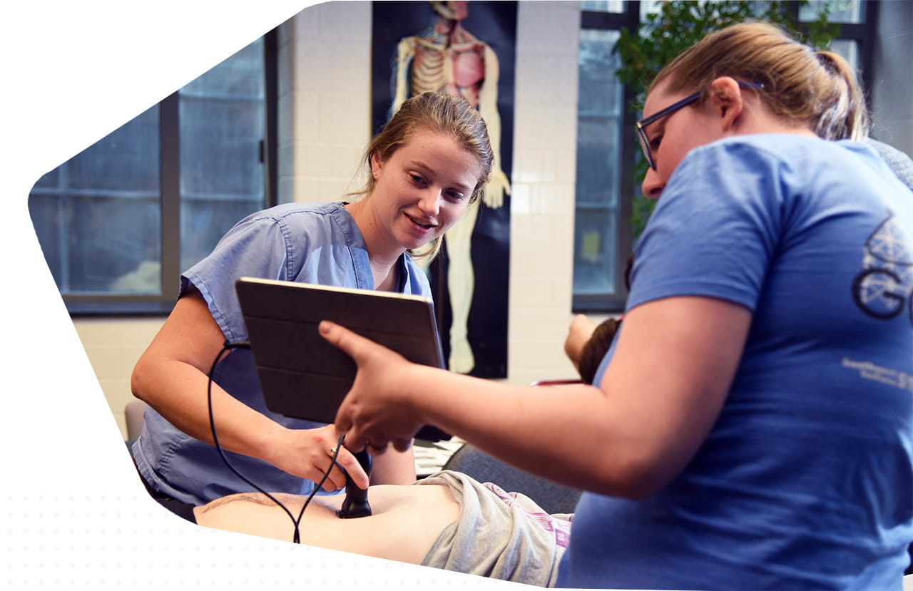 students practice point of care ultrasound in bloomington