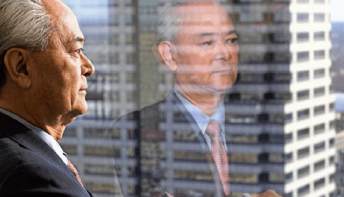 August Watanabe and reflection in window. 