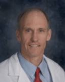 Portrait of Carl in lab coat smiling 