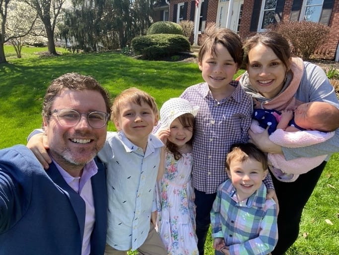 Dr. Emily Fitz smiles with her family. 