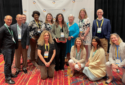 Dr. Sotto, center, poses with Dept. of Medicine colleagues at the AIM conference.