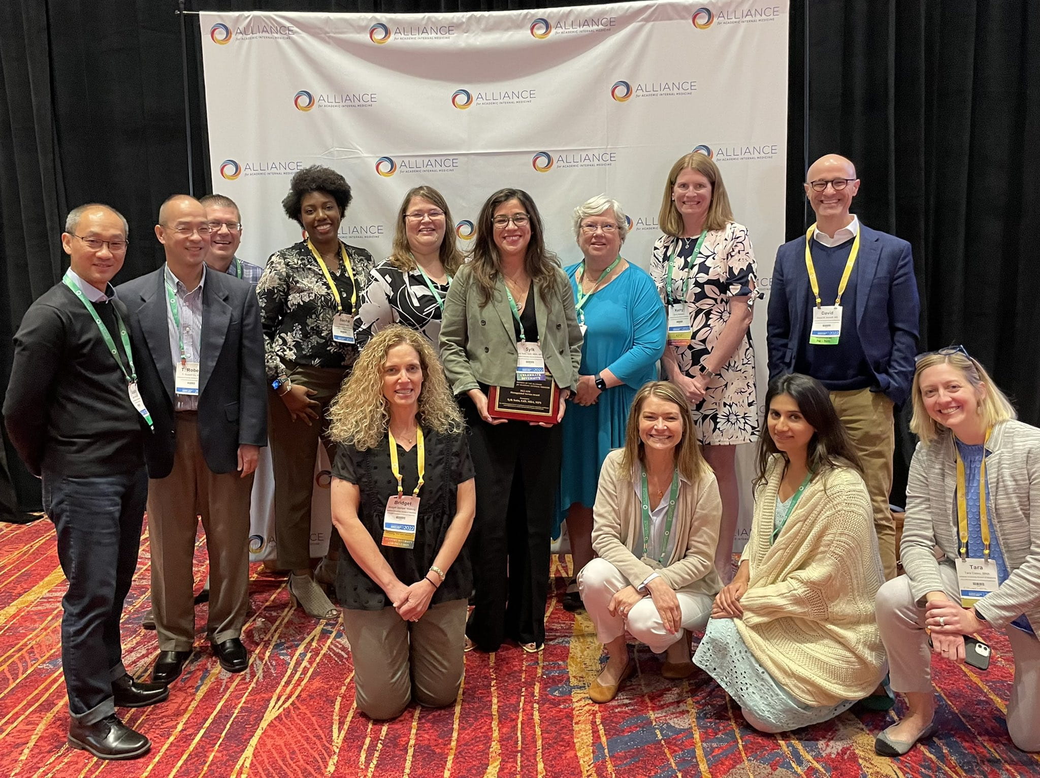 Dr. Sotto, center, poses with Dept. of Medicine colleagues at the AIM conference.