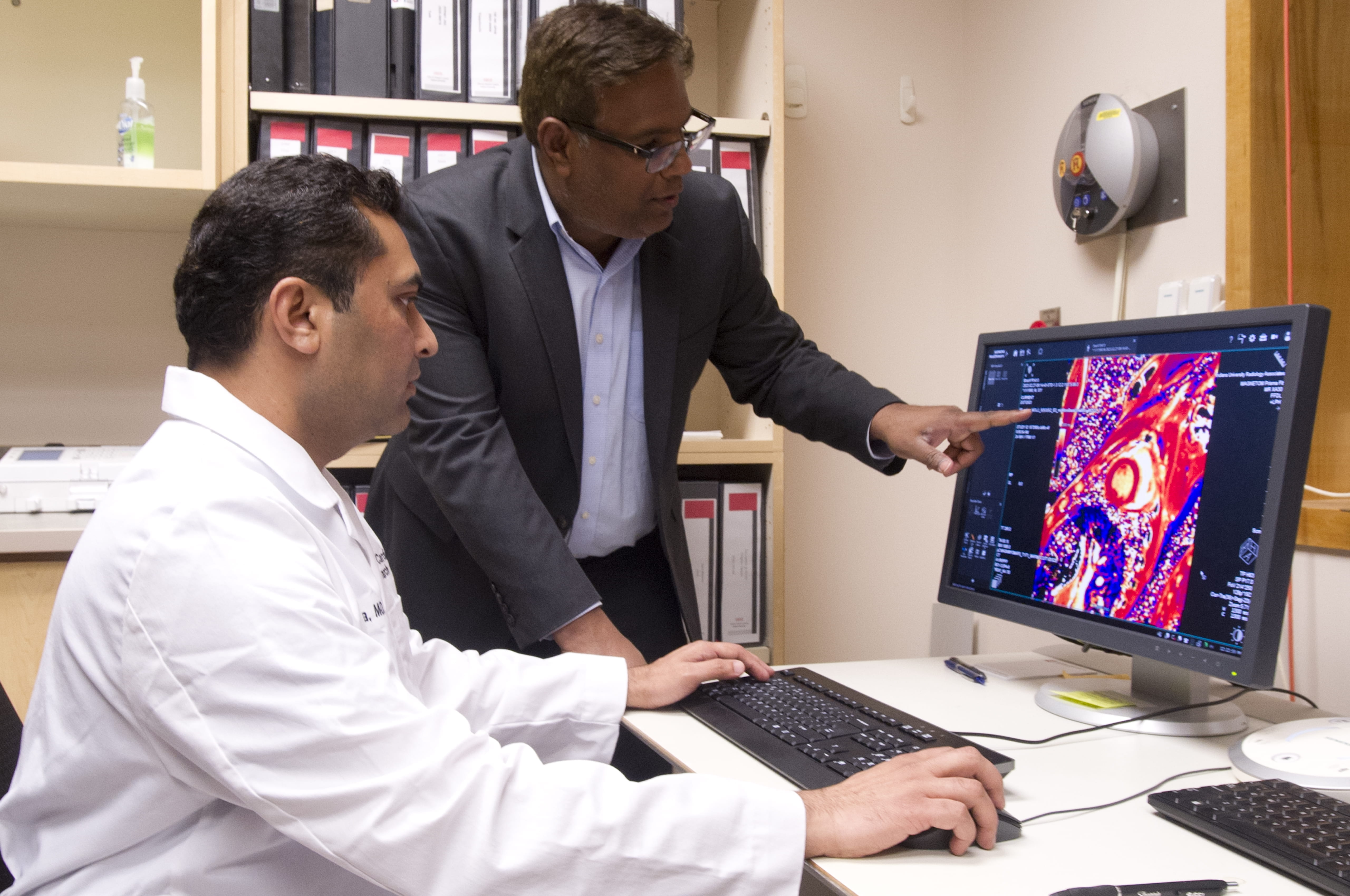 KCVRC investigators review a heart image. 