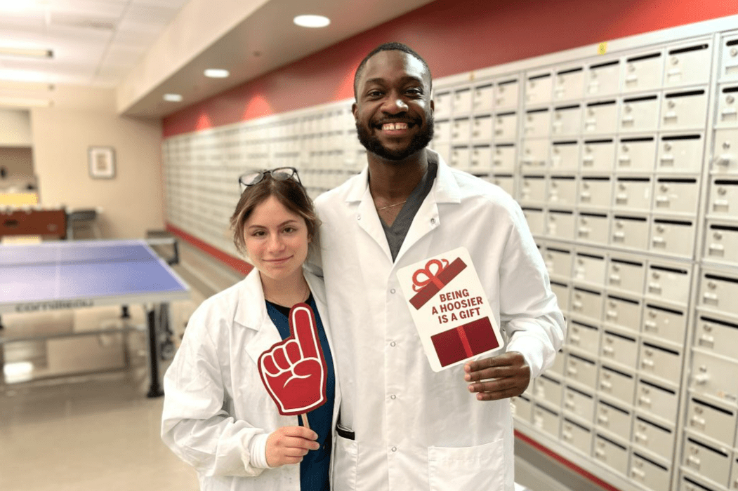 MD Pathology doctors hands using lab equipment in a red roon