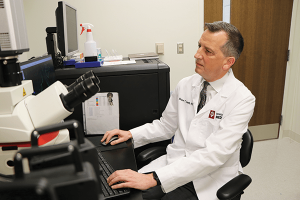 Bruce Lamb sitting at a computer