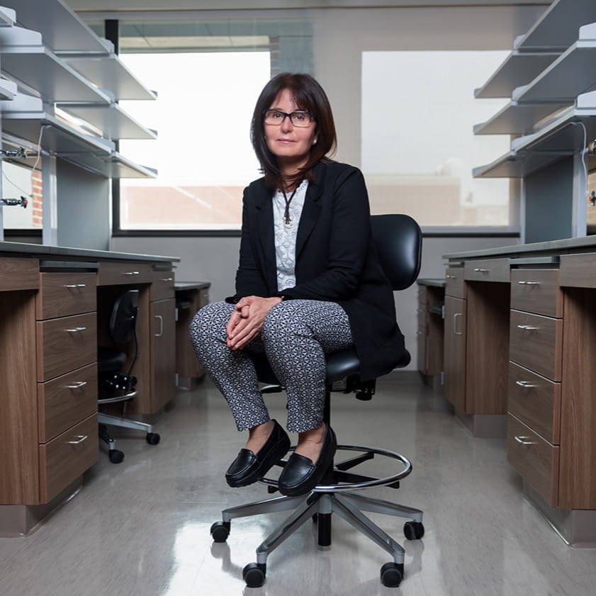 huda salman sits in her lab