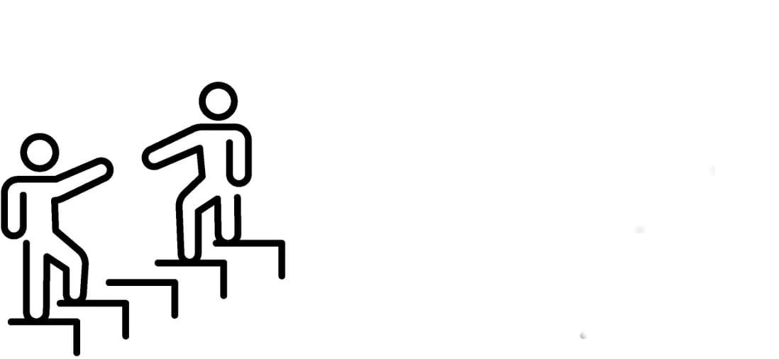 a person lifts up another person below them on the stairs