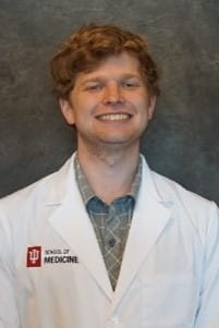 quen deckbar in a white coat