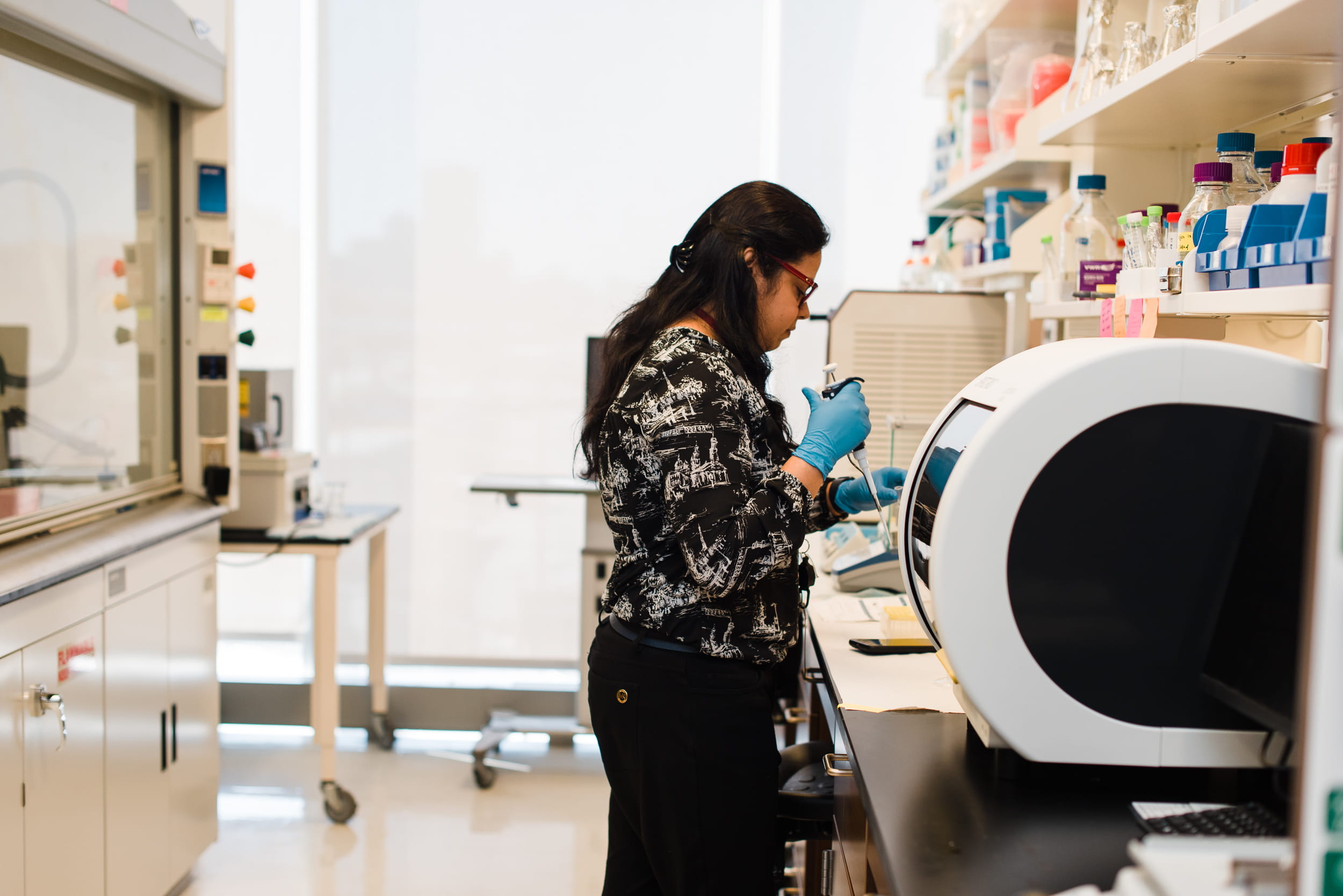 A researcher works in a IU School of Medicine biomarker lab.