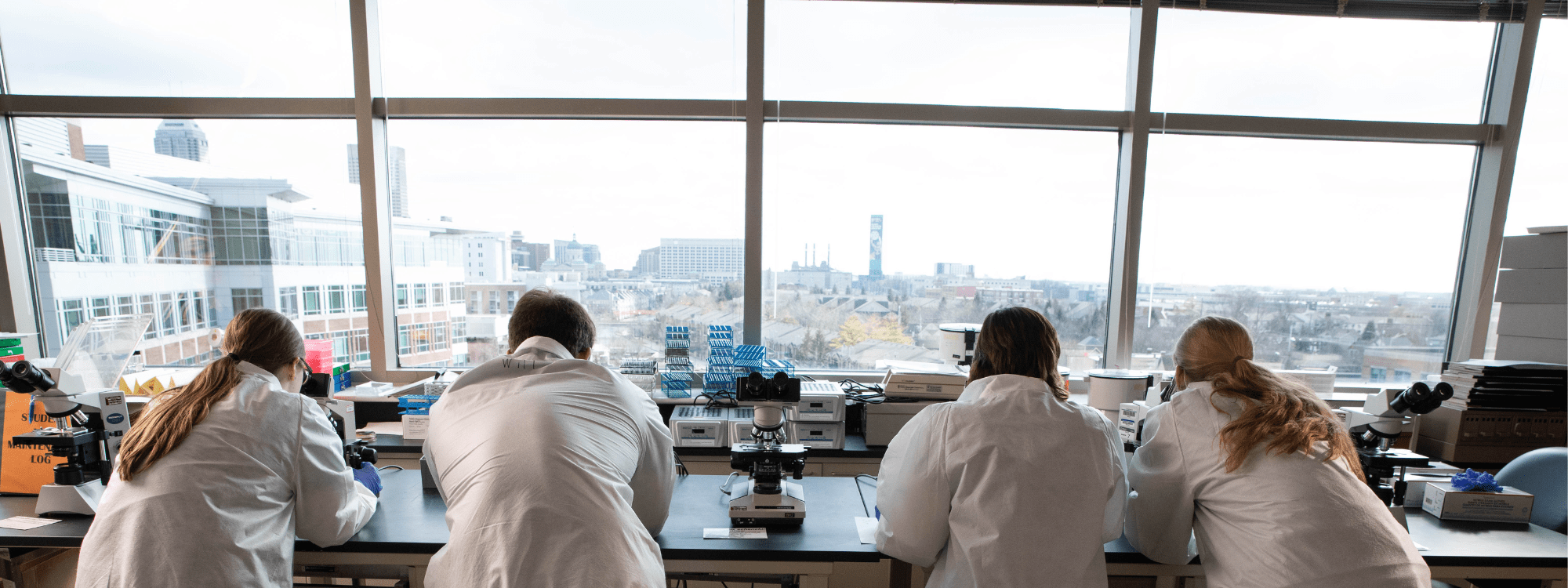 Four students in the Indiana University Pathology Lab