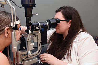 Elizabeth Martin, MD, examines a patient. 