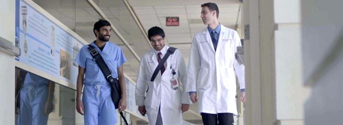 cardiology fellows walk through the hospital