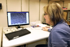 a staff scientist at work in the electron microscopy core