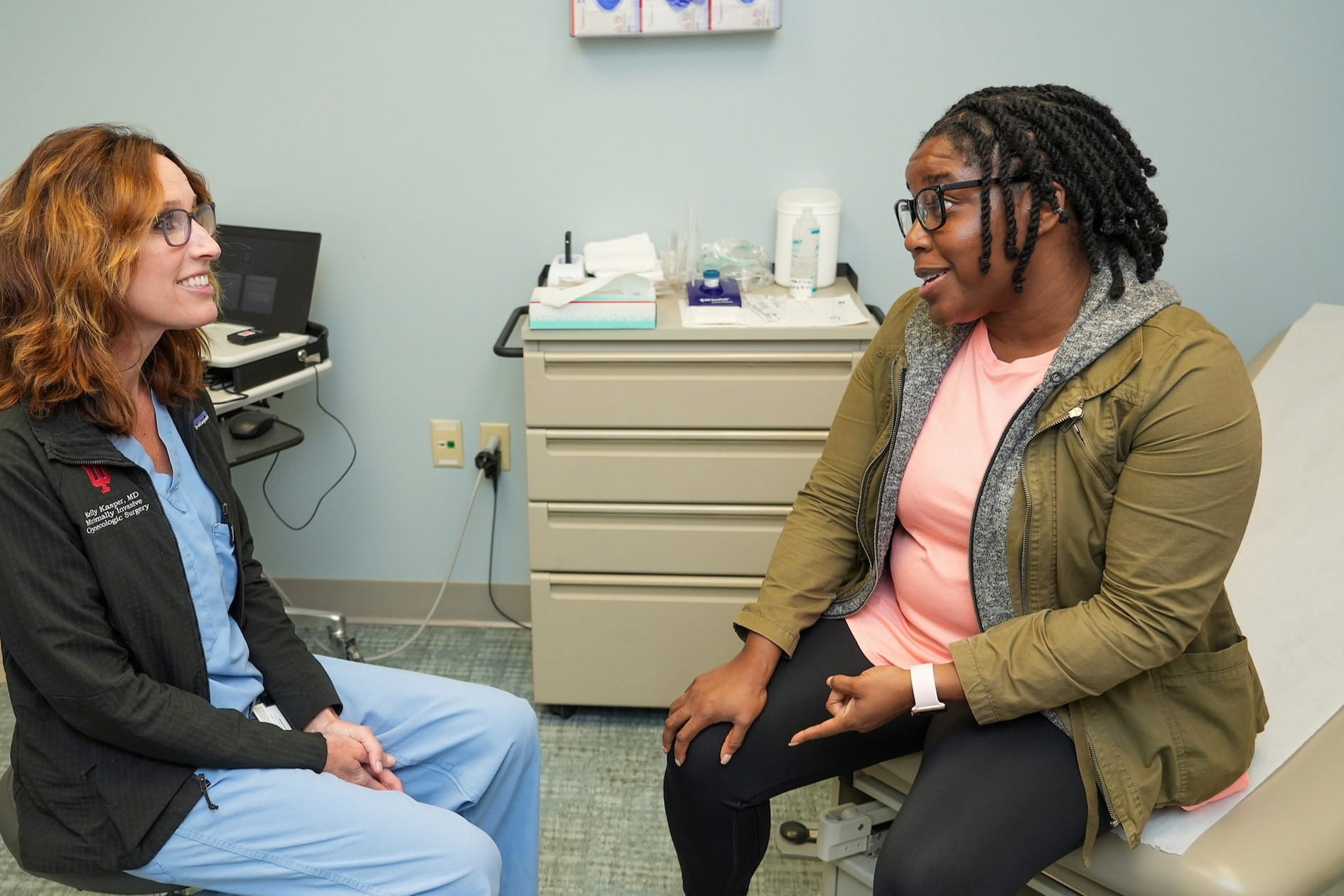 a patient speaks to Kelly Kasper in the clinic