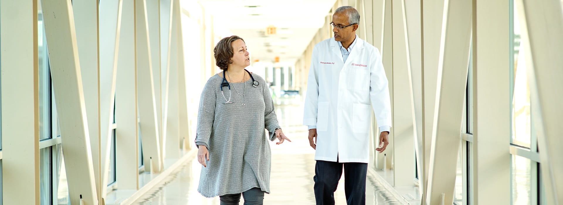 kathy miller and Harikrishna Nakshatri walk and discuss their work