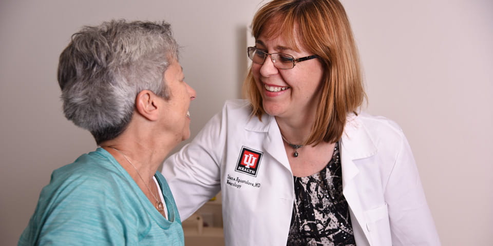 Liana Apostolova with a patient from her research study