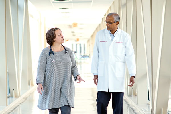kathy miller and Harikrishna Nakshatri walk and discuss their work